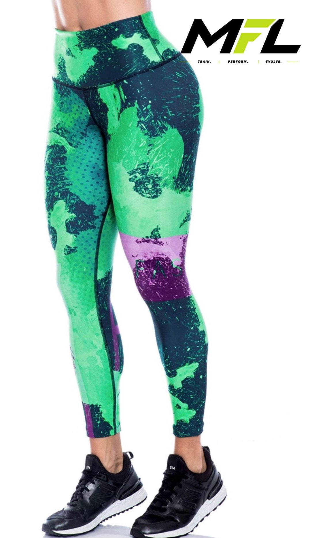 Woman wearing Emerald Pulse Leggings while posing sideways 