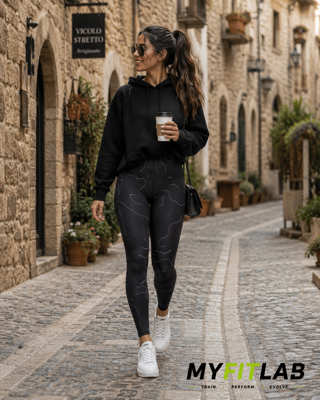 Woman wearing Phantom Camo Leggings while walking through an old town