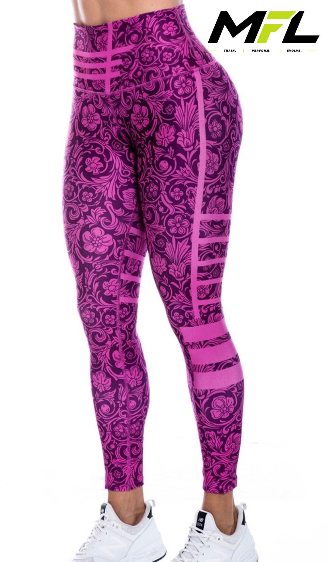 Woman wearing Pink Velocity Leggings colorful pink  with abstracts and flowers while posing side ways