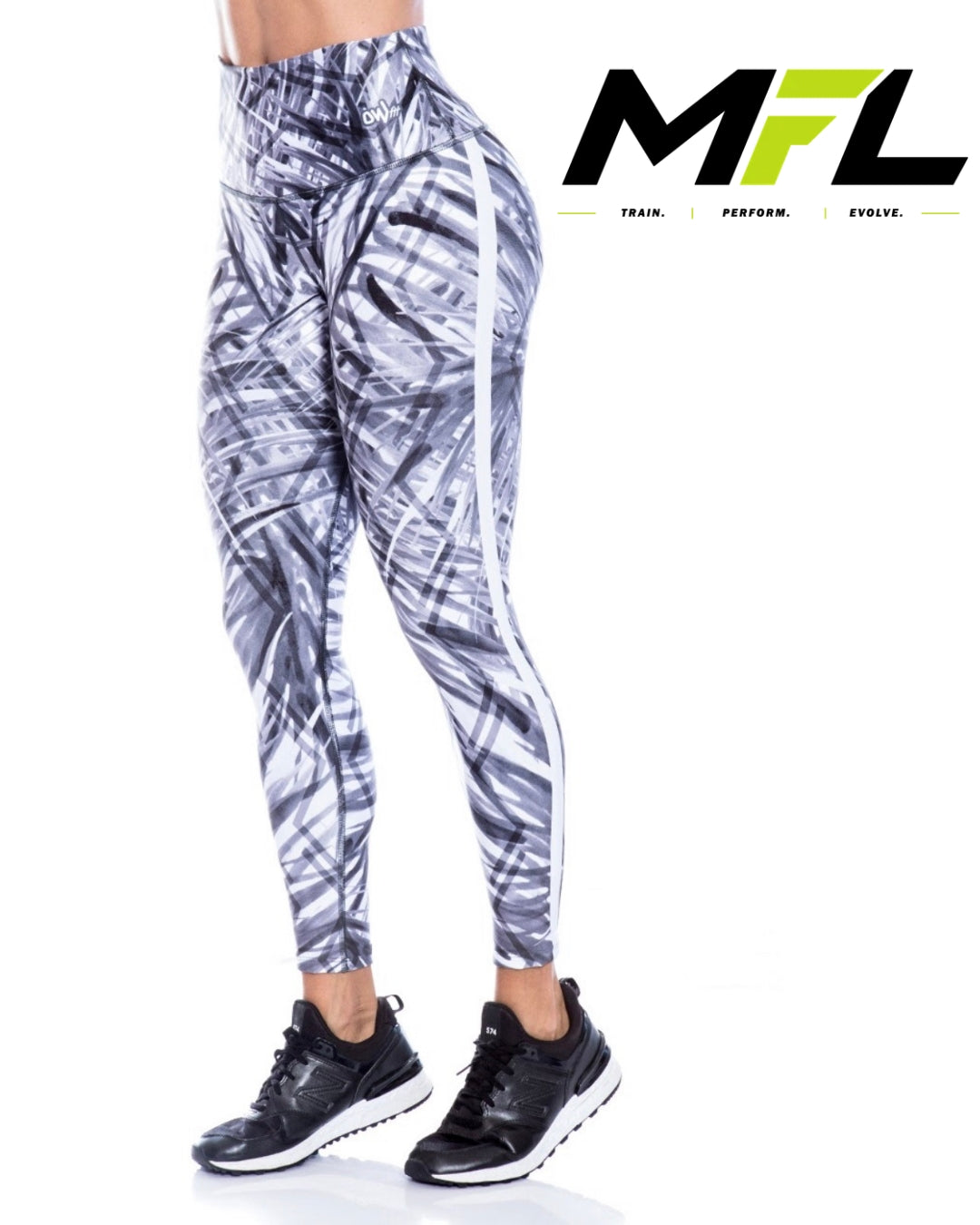 Woman wearing Silver Streak Leggings while posing sideways