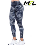 Woman wearing Titan Viper Leggings posing sideways 