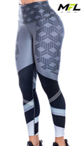Woman wearing Urban Velocity Leggings posing side ways with white background 